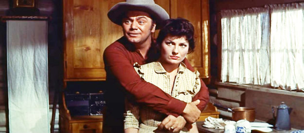 Ernest Borgnine as Shep Horgan, proudly showing off wife Mae (Valerie French) in Jubal (1956)