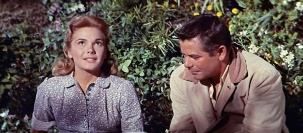 Felicia Farr as Naomi, telling Jubal Troop about the promised land her family is seeking in Jubal (1956)