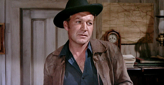 Forrest Tucker as Commissioner Cable, meeting Colt Saunders in Three Violent People (1957)