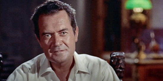 Frank Lovejoy as Bento Hermany, offering Sam Dent an ownership stake in his ranch in The Americano (1955)