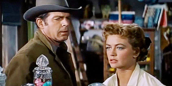 Fred MacMurray as Jack Wright and Dorothy Malone as his wife Martha, their life turned upside down by a heroic act in At Gunpoint (1955)