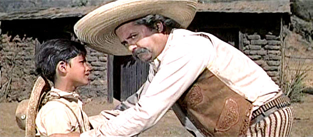 Garcia Pena as Pancho, saying goodbye to his son (Mario Navarro) before heading into the swamp in The Beast of Hollow Mountain (1956)
