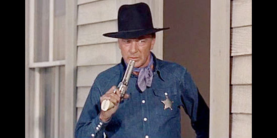 Gary Cooper as Gary Cooper, part of a star-studded final showdown in Alias Jesse James (1959)