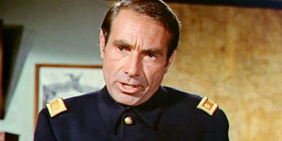 Gary Merrill as Maj. Stark Colton, trying to get information on the Indians from Martin Brady in The Wonderful Country (1959)