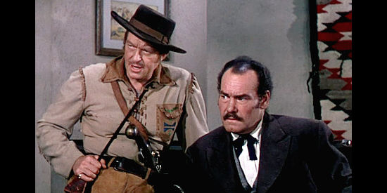 George Eldredge as Barney Demming and Harry Cording as Shayne MacGregor, conspiring to start a war between the U.S. and Britain in Brave Warrior (1952)