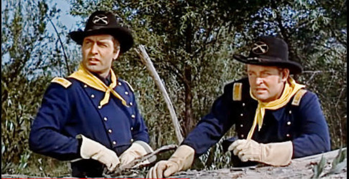 George Montgomery as Maj. Frank Archer, watching for hostile Indians with a fellow officer in The Battle of Rogue River (1954)