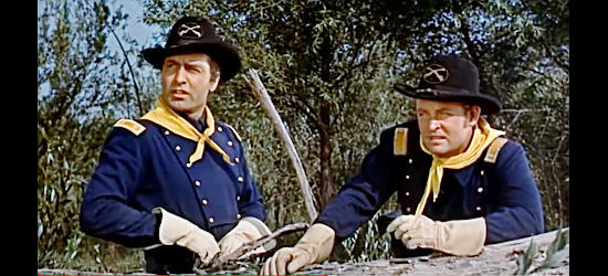 George Montgomery as Maj. Frank Archer, watching for hostile Indians with a fellow officer in The Battle of Rogue River (1954)