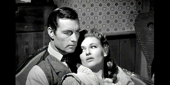 George Montgomery as Will Sabre with Ann Robinson as Judy in Gun Duel in Durango (1957)