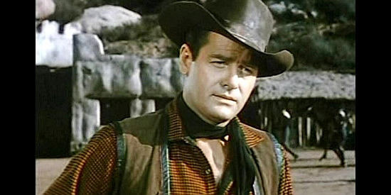 Gig Young as Ike Vaughn, leader of the outlaw gang in Slaughter Trail (1951)
