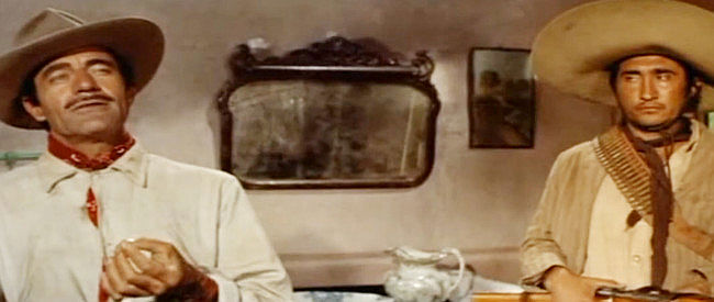 Gilbert Roland as Col. Jose Escobar and Rodolfo Acosta as Sebastian, meeting Wilson in Bandido! (1956)