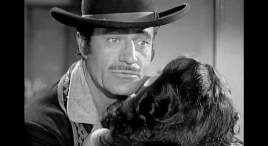 Gilbert Roland as Peso, romancing a dark-haired beauty and wondering if her husband is about to show up in Apache War Smoke (1952)
