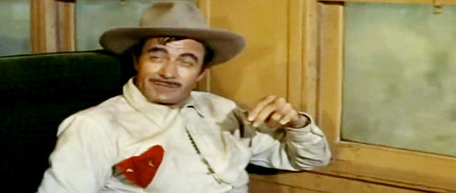 Gilbert Roland as revolutionary leader Col. Jose Escobar, hoping to obtain the cache of weapons in Bandido! (1956)