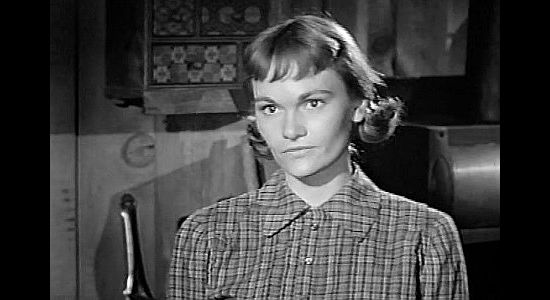 Gloria Talbott as Nora Bawdre, daughter of an outlaw with three young brothers to look after in The Young Guns (1956)