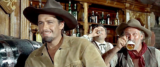 Gordon Scott as Buffalo Bill and Ugo Sasso as Snack, enjoying some time in the local saloon in Buffalo Bill, Hero of the Far West (1965)
