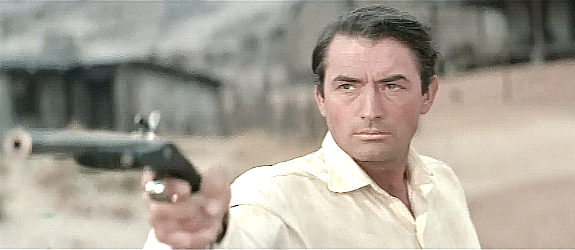 Gregory Peck as James McKay, engaged in an old-fashioned duel in The Big Country (1958)