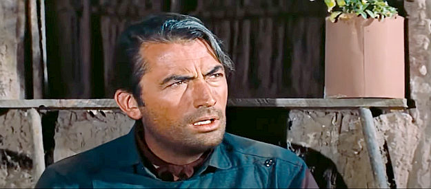 Gregory Peck as Jim Douglass, looking for answers at the home of one of the men he's been chasing in The Bravados (1958)
