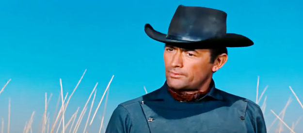 Gregory Peck as Jim Douglass, questioning one of the suspects in his wife's death in The Bravados (1958)