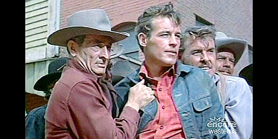 Guy Madison as Frank Madden, in the hands of a lynch mob in Reprisal! (1956)