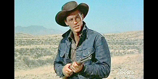 Guy Madison as Frank Madden, ordering a trespasser off his land in Reprisal! (1956)
