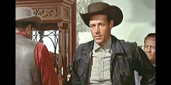 Guy Madison as Steve Burden, wondering which man in the saloon is the hired killer in The Hard Man (1957)