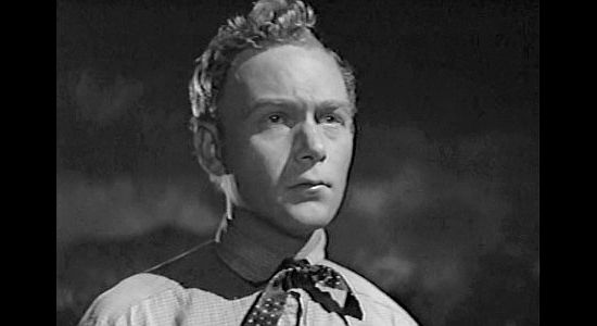 Harry Carey Jr. as Sandy, itching to do something about the Clegg gang's arrival in Wagon Master (1950)