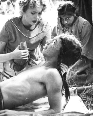 Helen Wescott as Winifred Lancaster cares for a sick Indian brave in Batles of Chief Pontiac (1952)