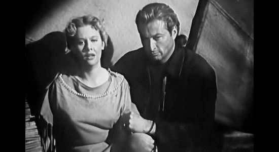Helen Westcott as Winifred Lancaster and Lex Barker as Kent McIntire consoling one another in Battles of Chief Pontiac (1952)