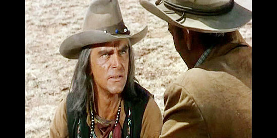 Henry Brandon as Maygro, considering Maj. Brady's suggestion that the Seminole help quell a Kiowa uprising in War Arrow (1953)