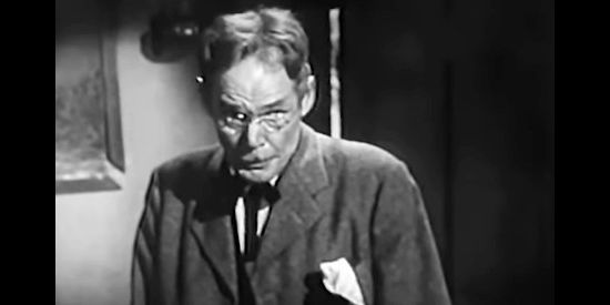 Henry Hull as Doc Medley, caught fibbing to get someone to buy his doctor's practice in The Buckskin Lady (1957)j