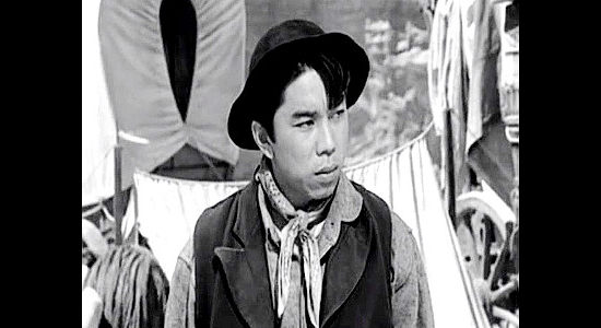 Henry Nakamura as Ito Kentaro, the cook on the trip West, convinced Buck Wyatt is driving the women too hard in Westward the Women (1951)