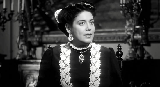 Hilda Moreno as Senora Alvarado, encourating her daughter Carmel to be courteous to the rich Patrick O'Moore in My Outlaw Brother (1951)