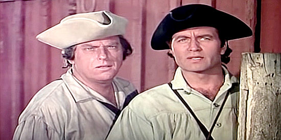 Howard Petrie as Maj. Rogers and George Montgomery as Capt. Horn, snooping out of uniform in Fort Ti (1953)