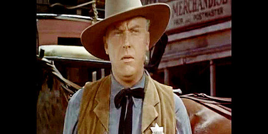 Howard Petrie as Sheriff Brand, a lawman who resents Jim Kipp's presence in his town in The Bounty Hunter (1954)