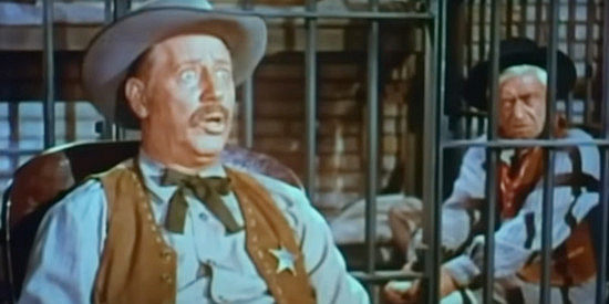 Irving Bacon as Sheriff Anders, caught off guard by a suggestion from Marshal Hollister in Rose of Cimarron (1952)