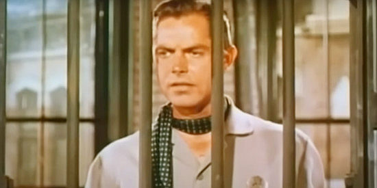 Jack Beutel as Marshal Hollister, not exactly pleased to have Rose in a jail cell in Rose of Cimarron (1952)