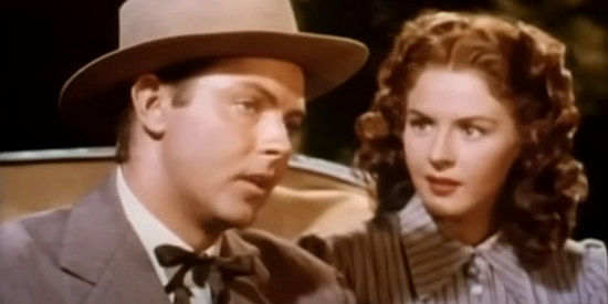 Jack Buetel as Marshal Hollister and Mala Powers as Rose, getting to know one another better in Rose of Cimarron (1952)