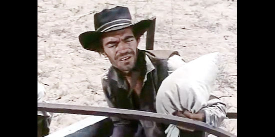 Jack Elam as Tioga, discovering what Jonah has in his wagon in Dragoon Wells Massacre (1957)