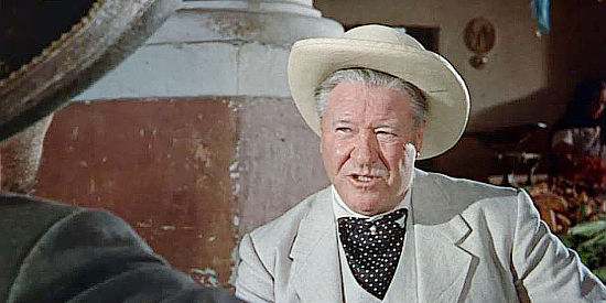 Jack Oakie as Travis Hyte, the man who lures Americans, including Mrs. Colton, to Mexico for a fiesta in The Wonderful Country (1959)