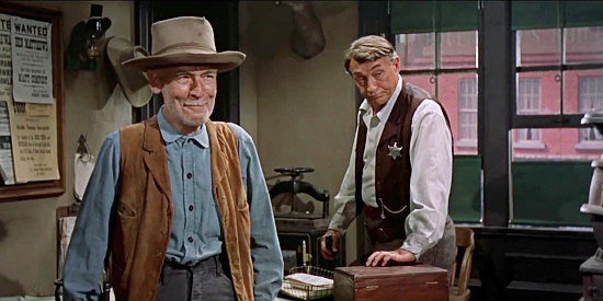 James Gleason as Orval Jones and Paul Fix as Deputy Mike MacNamara, watching the sheriff face the predicament of searching Nellie for weapons in Star in the Dust (1956)