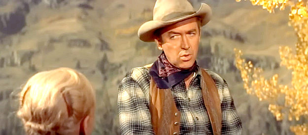 James Stewart as Grant McLaine, a railroad employee who lost his job by giving his outlaw brother a break in Night Passage (1957)