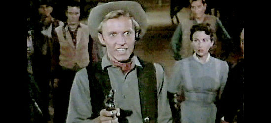 Jan Merlin as Billy Brand, a young hothead pulling a gun on West End's preacher in A Day of Fury (1956)