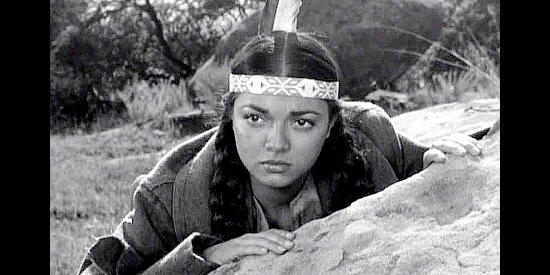 Jana Davi as Tanana, fearful about what will happen now that she and her friends have found Trench in Gun Fever (1958)