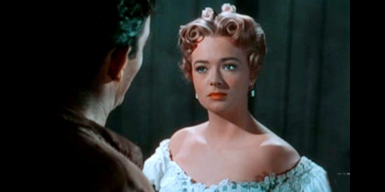 Jane Nigh as Ann Pickett, using all her charms to try to change Tom Clay's mind about guiding her father's wagon train in Fort Osage (1952)