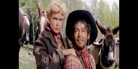 Janet Leigh as Lina Patch, giving Ben (Robert Ryan) one of his frequent back rubs in The Naked Spur (1953)