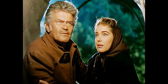 Jay C. Flippen as Jeremy Baile and Julie Adams as Laura Baile, sensing sounds of hope in Bend of the River (1952)