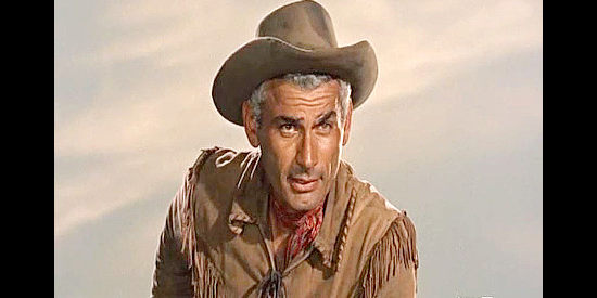 Jeff Chandler as Lon Bennett, warning the Basques of the dangers ahead in Thunder in the Sun (1959)