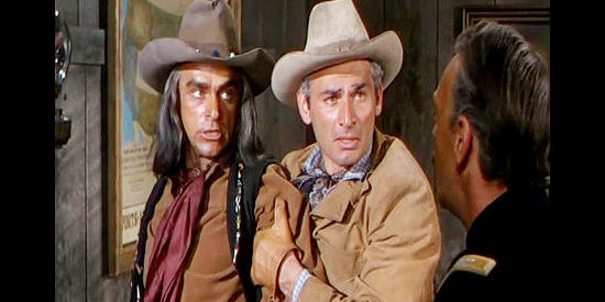 Jeff Chandler (middle) as Maj. Howell Brady, trying to calm Seminole leader Maygro (Henry Brandon) after the Army has broken a promise in War Arrow (1953)