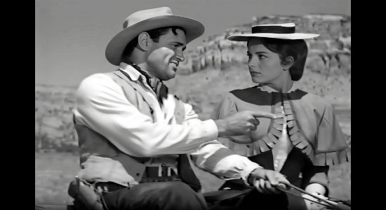 Jeff Morrow as Hack WIlliams, threatening to throw Nora Haynes off his wagon in Copper Sky (1957)