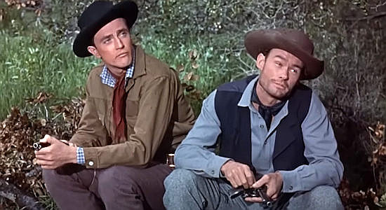 Jerry Barclay as Jordan Keefer and Roy Hayes as his brother Walt, talking about evening a score with older brother Ben in Gunmen from Laredo (1959)