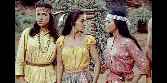 Jil Jarmyn as Nona (right), with a knife against the back of Riva (John Taylor) as Mangus fights for his life while Yellow Moon (Jeanne Carmen) looks on in War Drums (1957) 